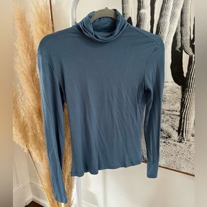 Dusty blue, fitted, stretchy turtleneck top from dynamite in size small